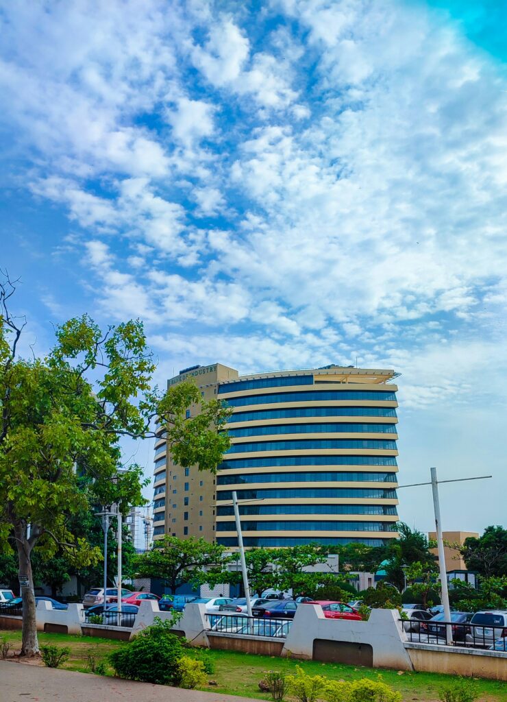 A modern circular commercial building in Abuja Nigeria representing the impact of Nigeria's Decarbonisation Bill on real estate and property development