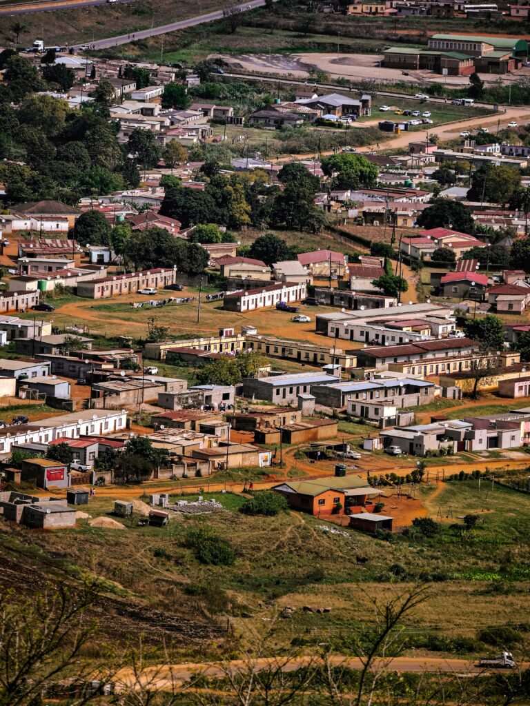 Aerial view of an African urban township showing unplanned settlement patterns and the urgent need for climate resilient building enforcement