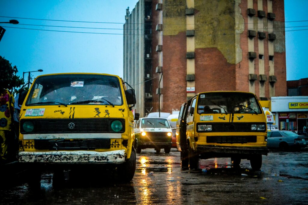 Lagos yellow buses on flooded wet streets during heavy rainfall showing climate vulnerability and the urgent need for climate health financing in Nigeria