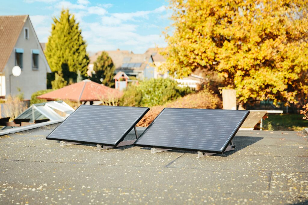 Two solar panels installed on a residential rooftop representing the rise of solar powered real estate and green housing in Nigeria