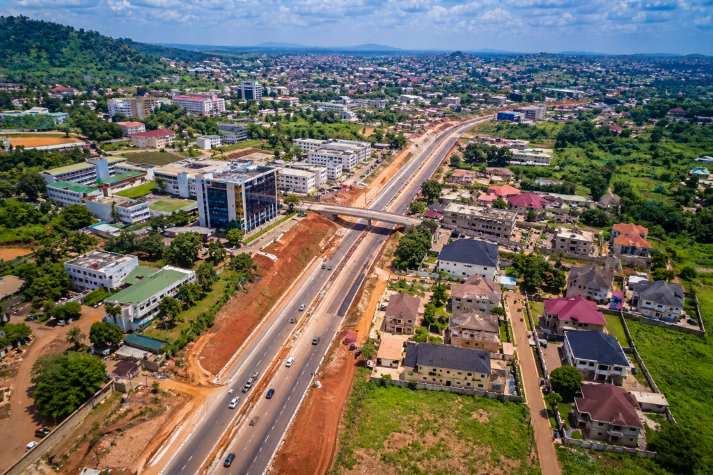 Aerial view of Enugu showing road construction and expanding residential areas driving real estate growth.