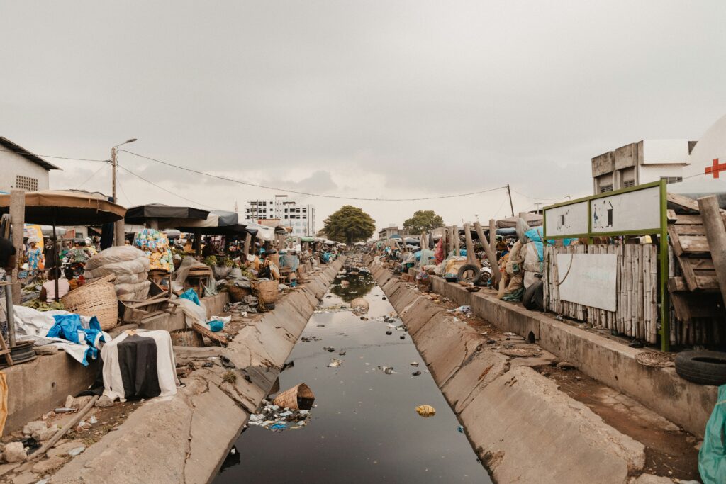 Climate Risk Valuation Gap in Nigeria showing flooded residential homes and the impact of hidden climate risks on property value